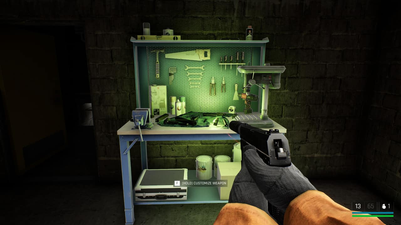 How to customise guns in Trepang2: Subject 106 locates a workbench to modify his pistol at.