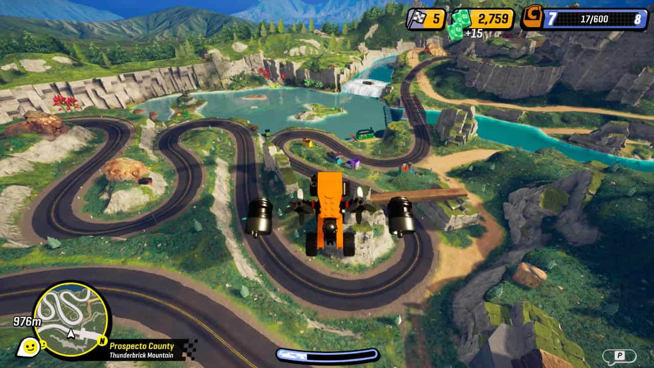 How to remove weeds in Lego 2K Drive: A lawnmower car mid-air over a race track.