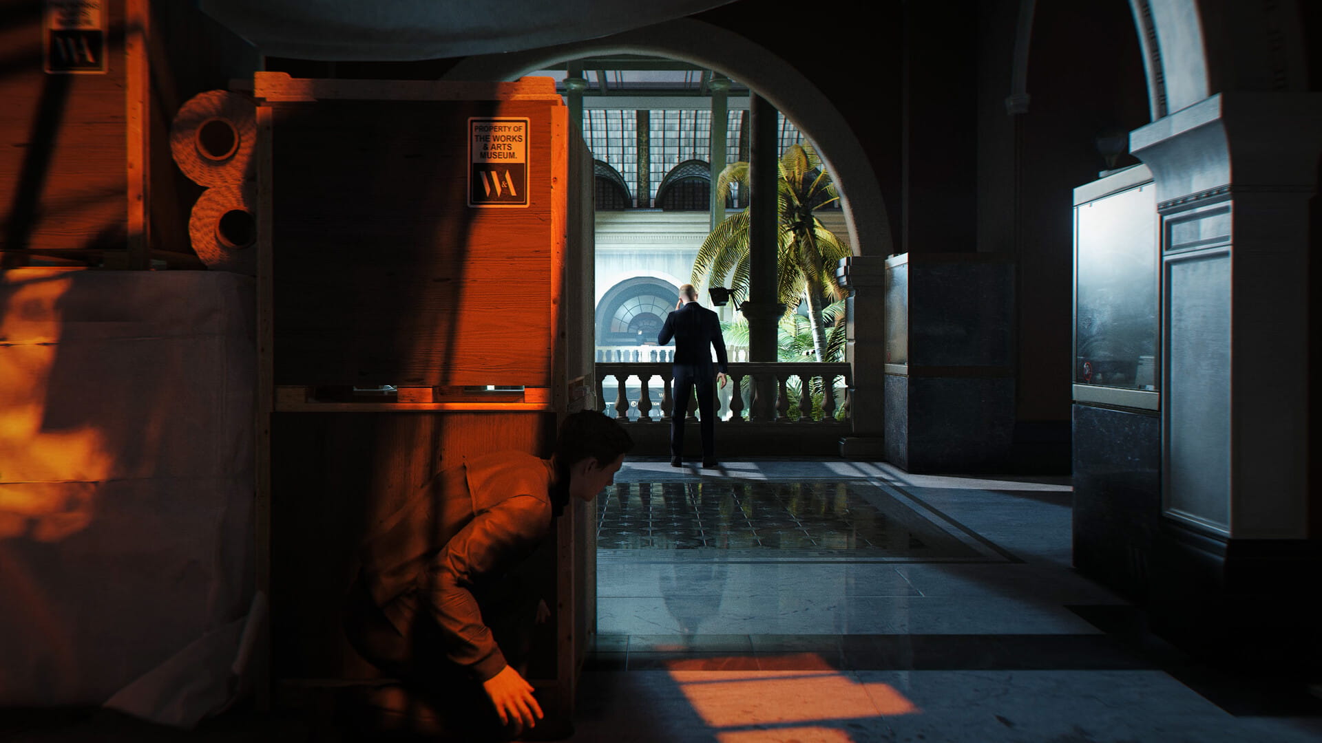 Bond hiding behind crates in a museum