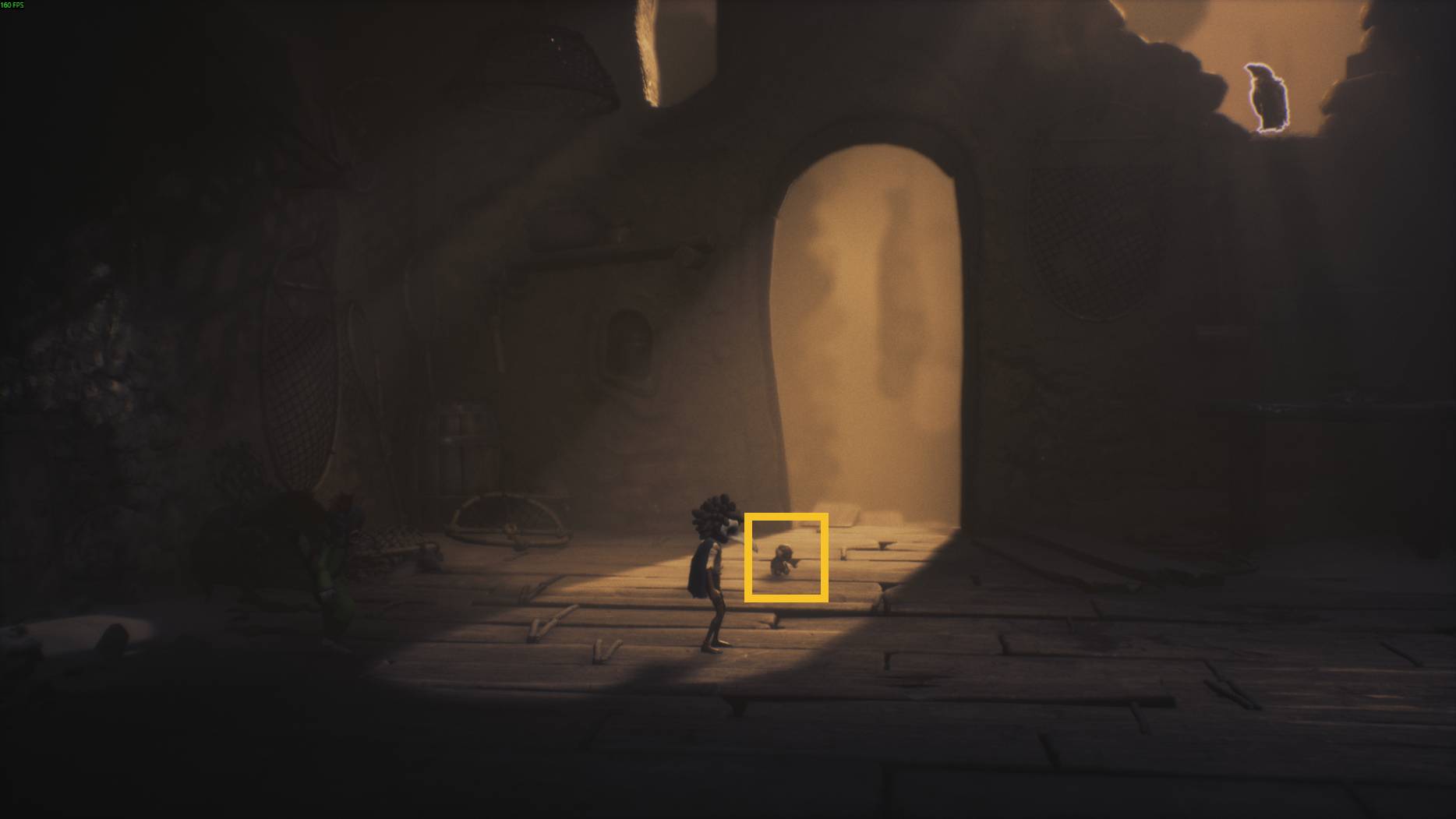 A small character stands in a sunlit doorway in Little Nightmares 3, as shadows fill the dark wooden room around them
