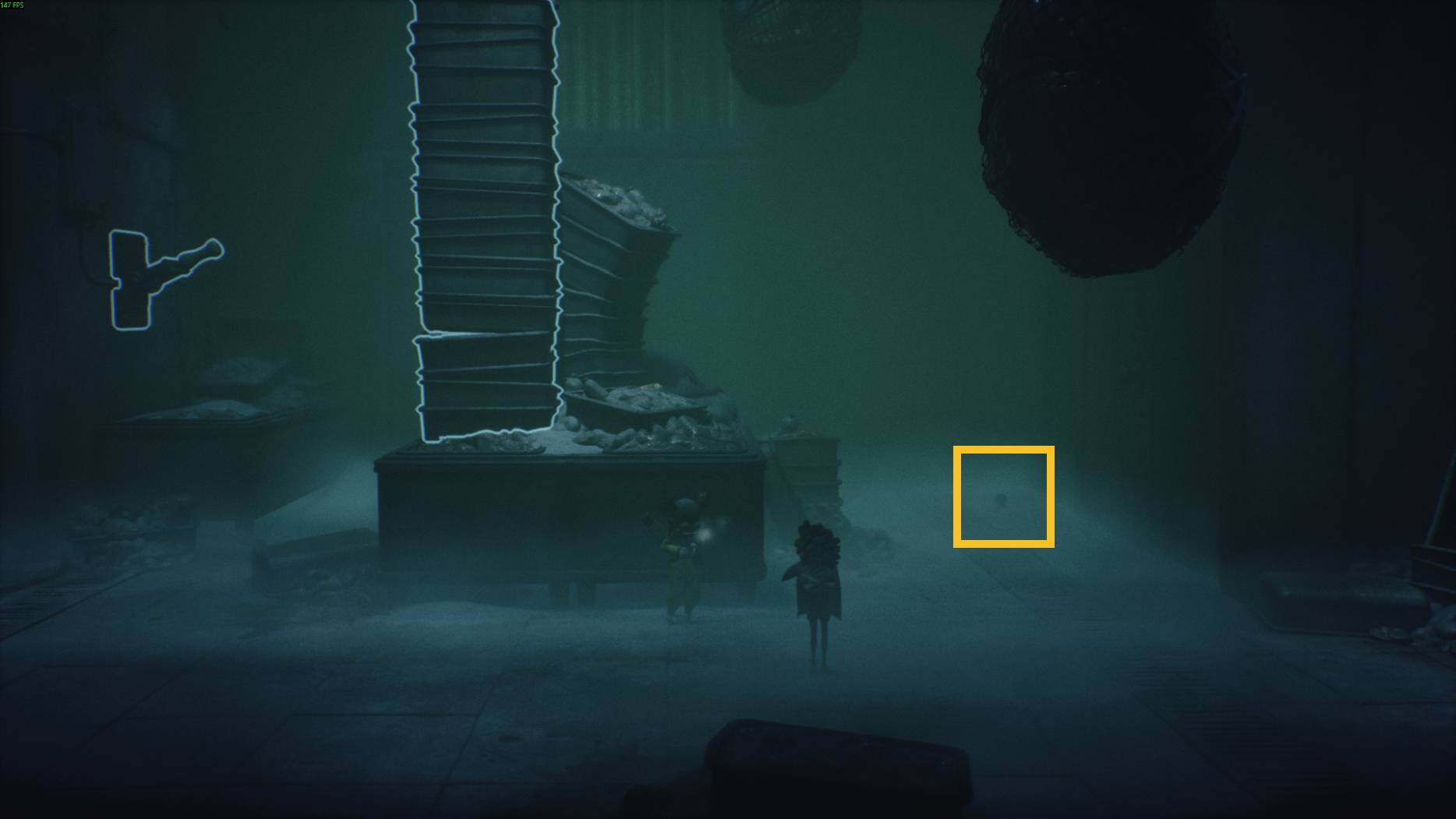 Two small characters explore a foggy room in Little Nightmares 3, with a glowing lever on the wall and towering stacks of trays.