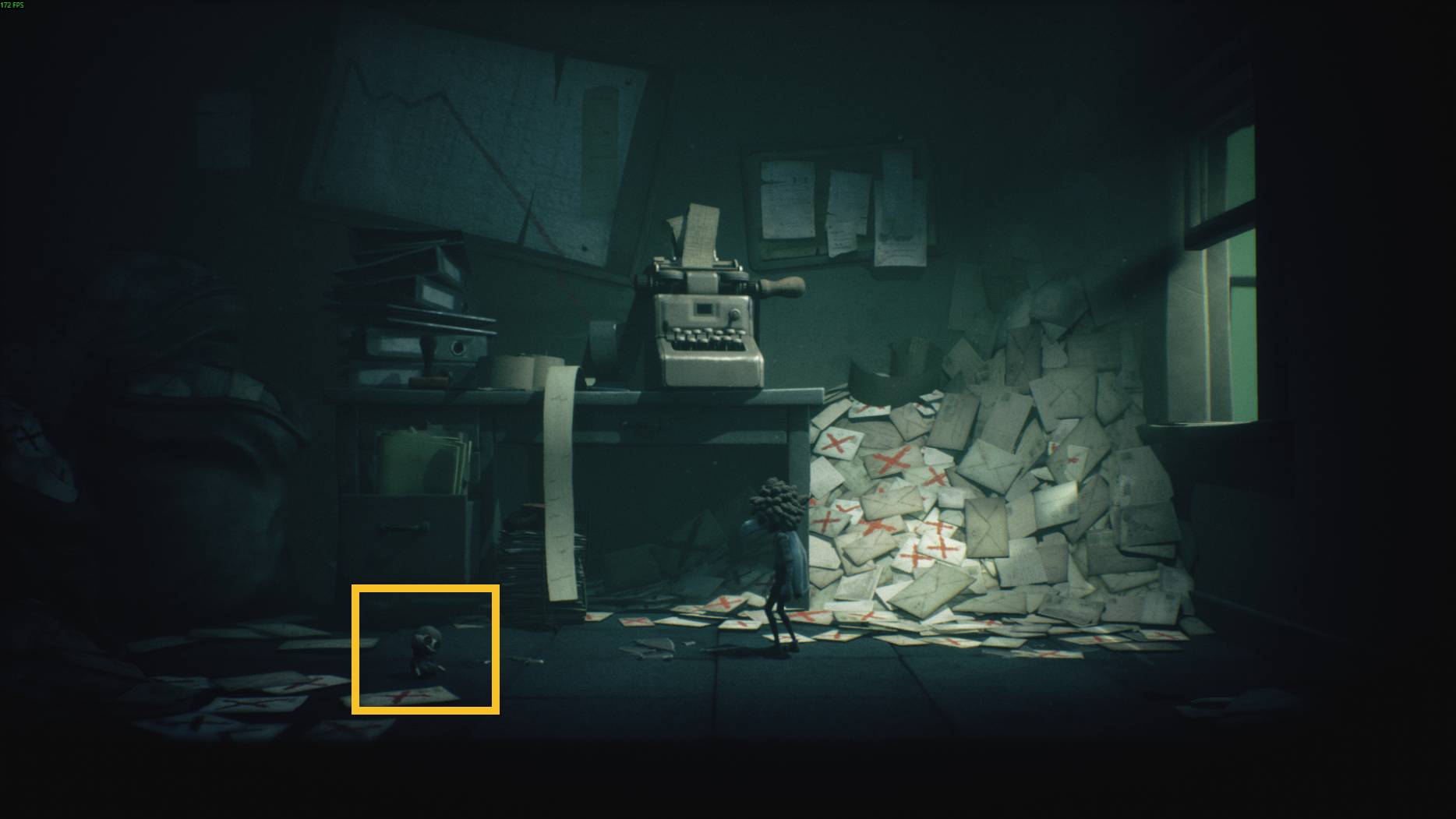 Small characters explore a dark mailroom in Little Nightmares 3, with piles of letters marked by red crosses and an old typewriter on the desk
