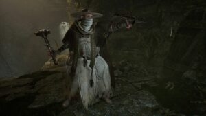 A man in a white robe, dazzling with the power of the best radiant spells, is standing in a cave.