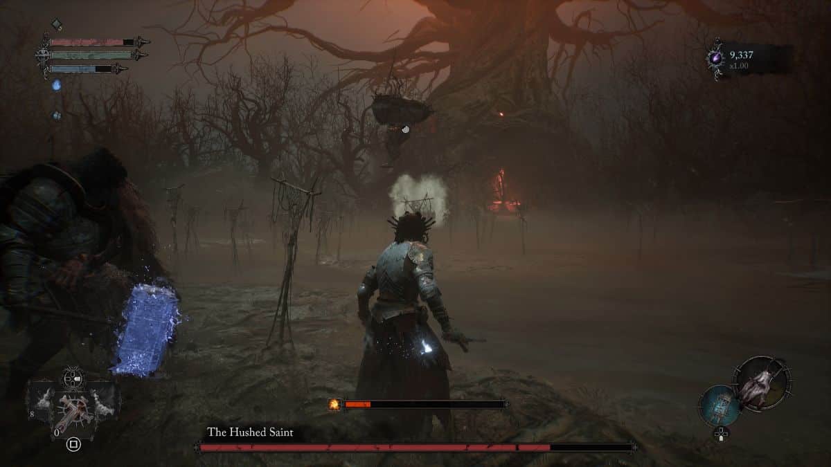 A screenshot of a video game showing a man and a woman in a forest, with tips on how to beat the hushed saint.