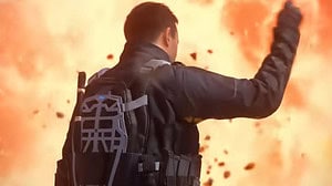 A man in a tactical vest and backpack raises his fist in front of a large explosion during an MW3 sale event.