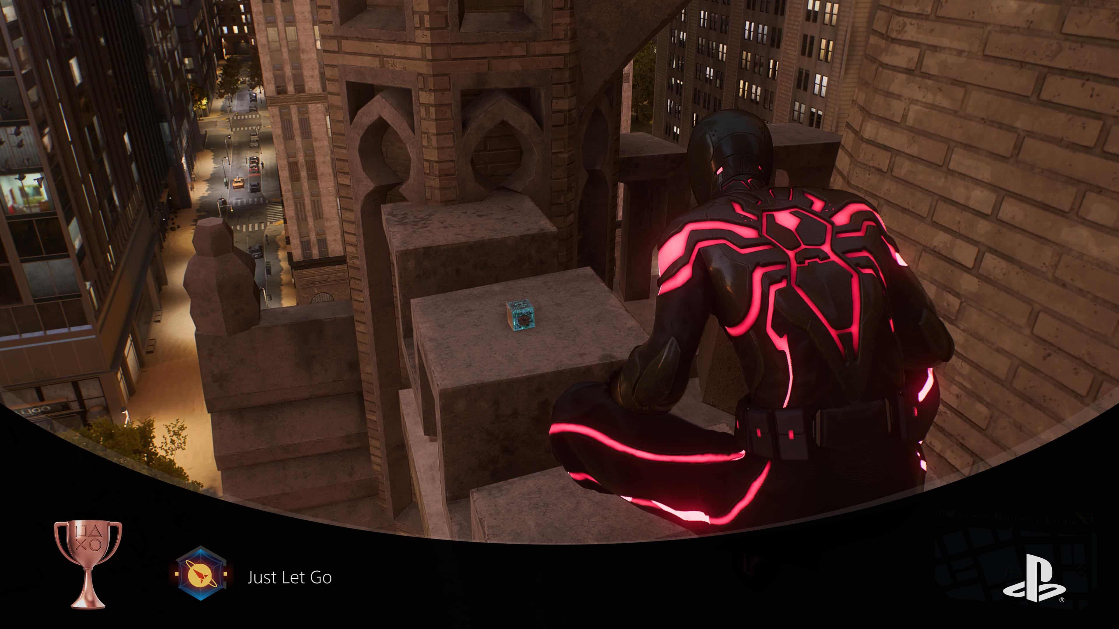 Marvel's Spider-Man 2 - A spider-man is standing on top of a building, searching for Miles and Phin's science trophy.