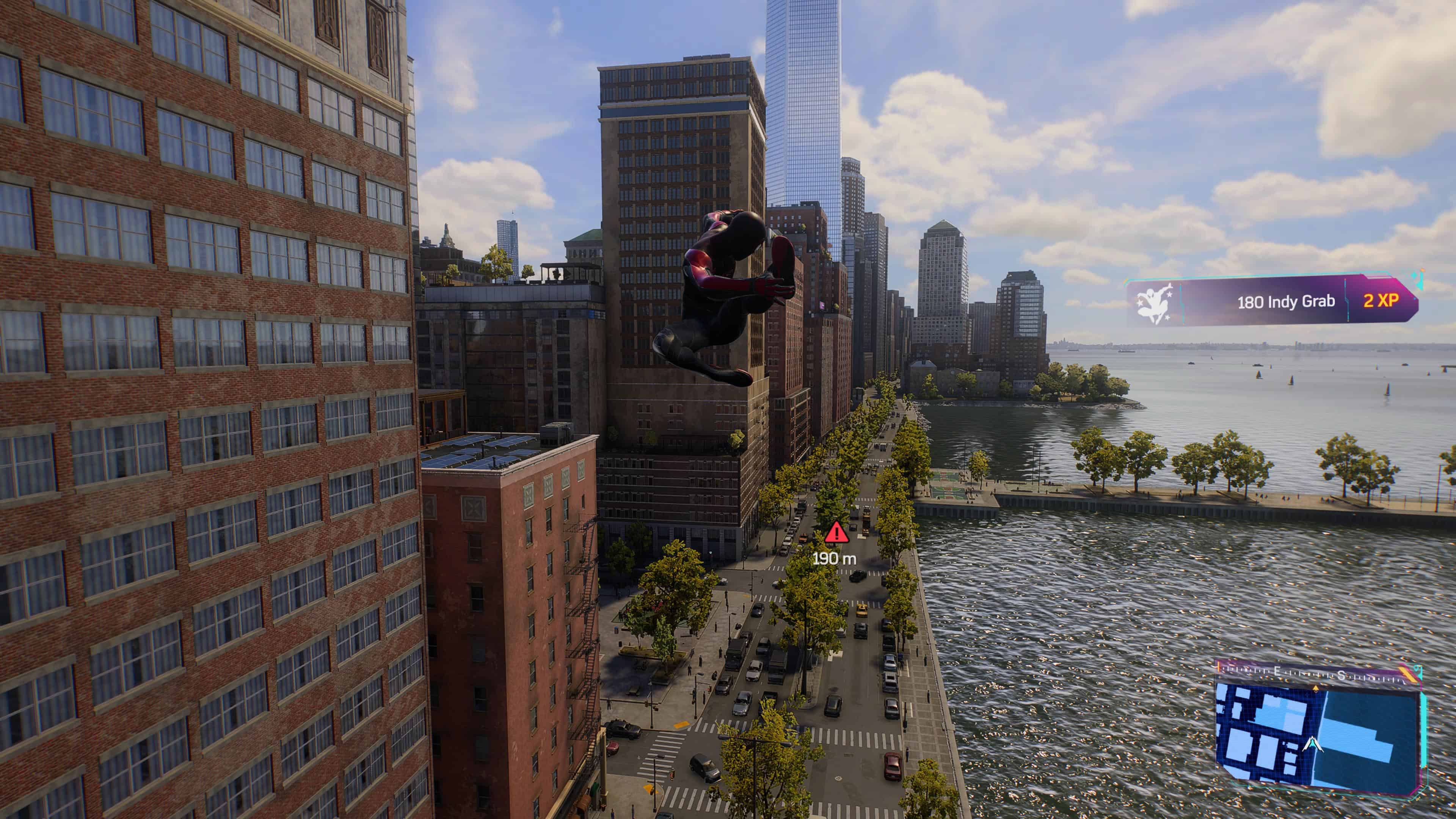 Spider-Man 2: Miles effortlessly flying over a city, showcasing some impressive tricks.