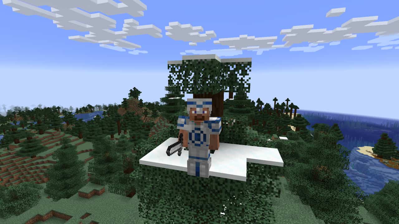 Minecraft armor trims: A player in blue-trimmed iron armour stands on top of a tree facing the camera.