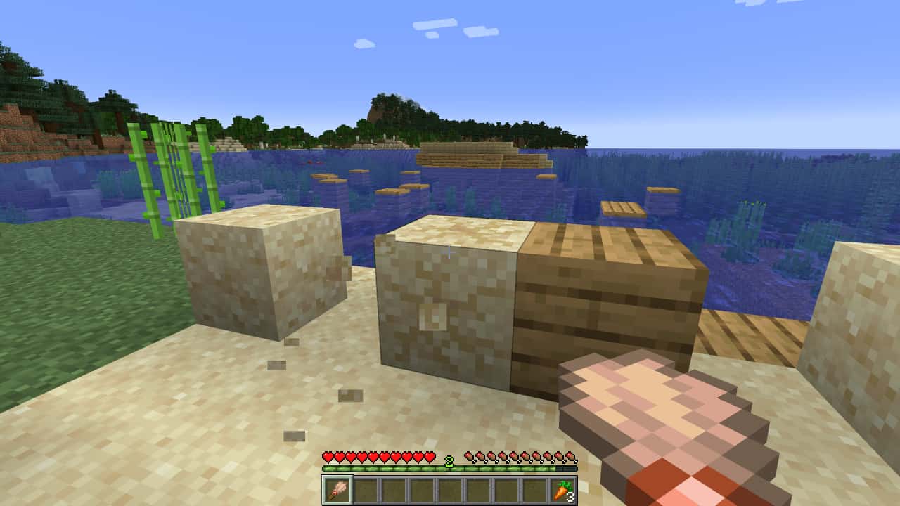 Minecraft archeology: A player excavates a suspicious sand block with a brush nearby a coastal shipwreck.