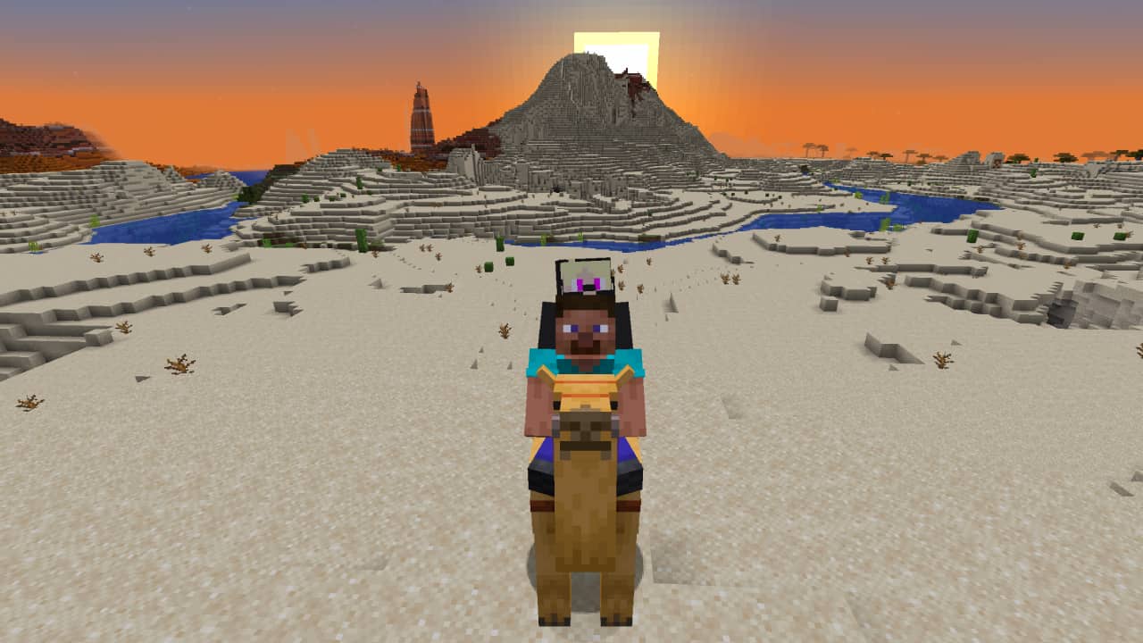 Minecraft camels guide: Two players ride a camel through the desert together.
