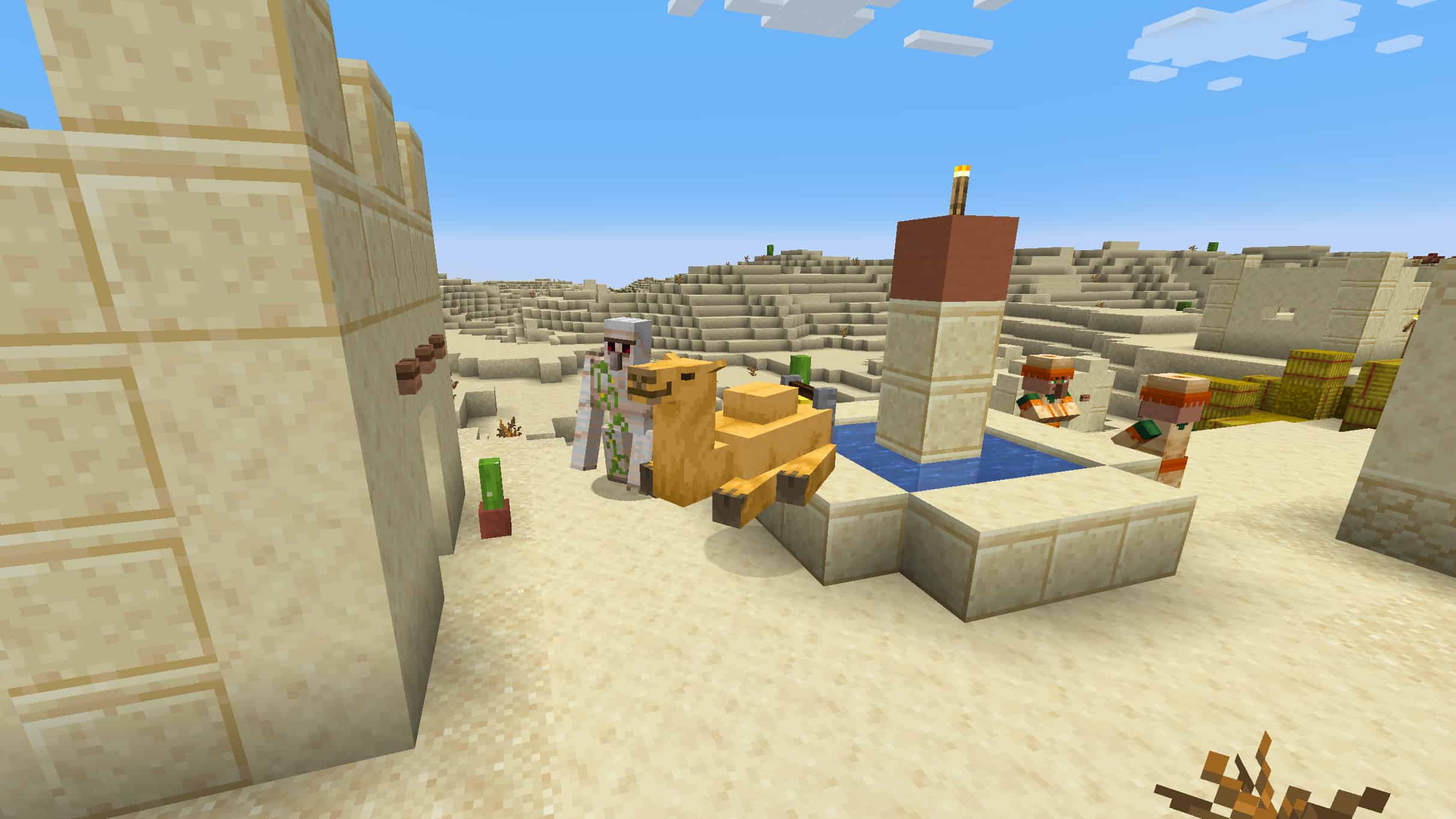 Minecraft camels guide: A camel sits on the lip of a fountain in a desert village.