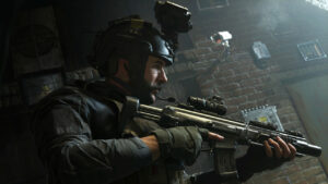 A soldier in tactical gear holding a rifle indoors, with a helmet equipped with cameras and night-vision goggles, resembling scenes from Call of Duty: Modern Warfare 2019.