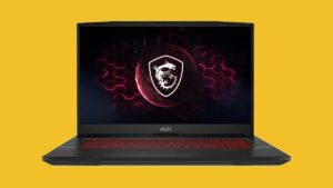 A black laptop with a red logo on a yellow background.