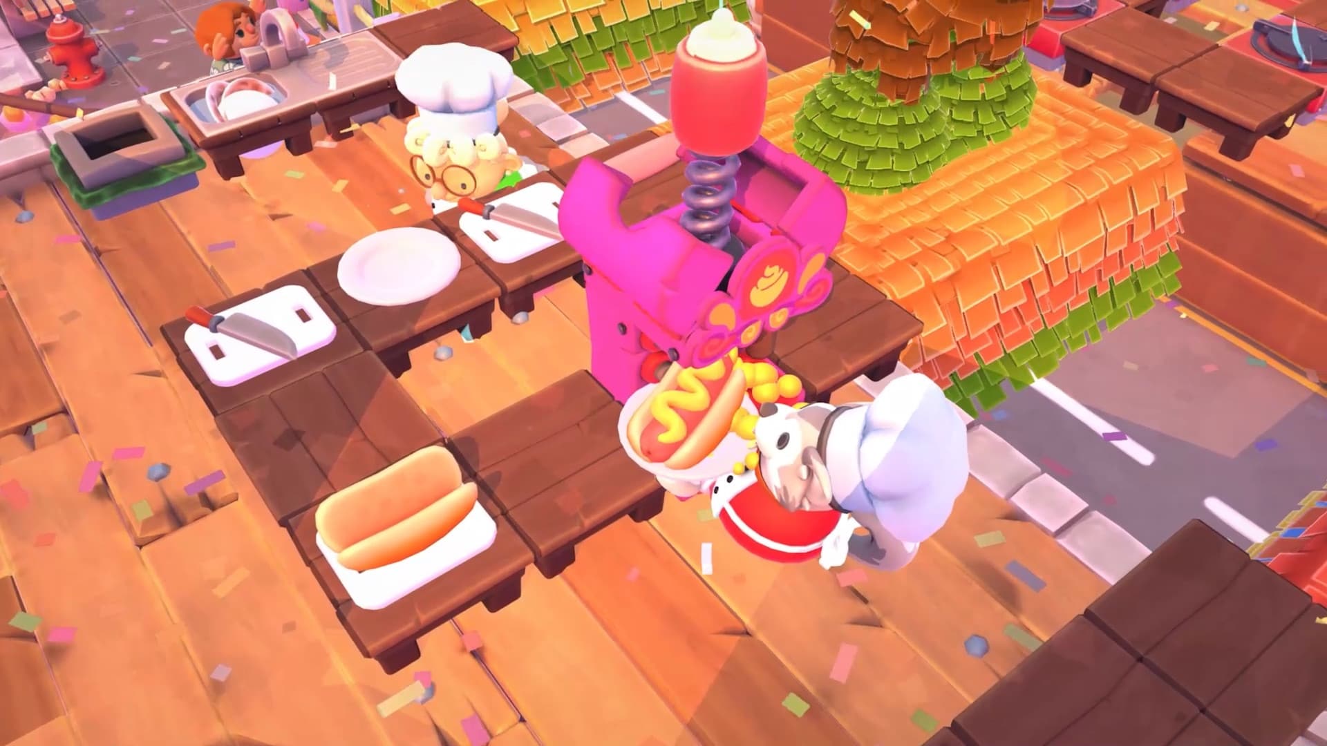 Overcooked 2 chefs preparing hot dogs together in a colorful and hectic kitchen