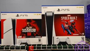 Two playstation PS4 consoles sitting on a shelf, potentially awaiting the arrival of the PS5 Slim bundled with MW3 reportedly launching soon.