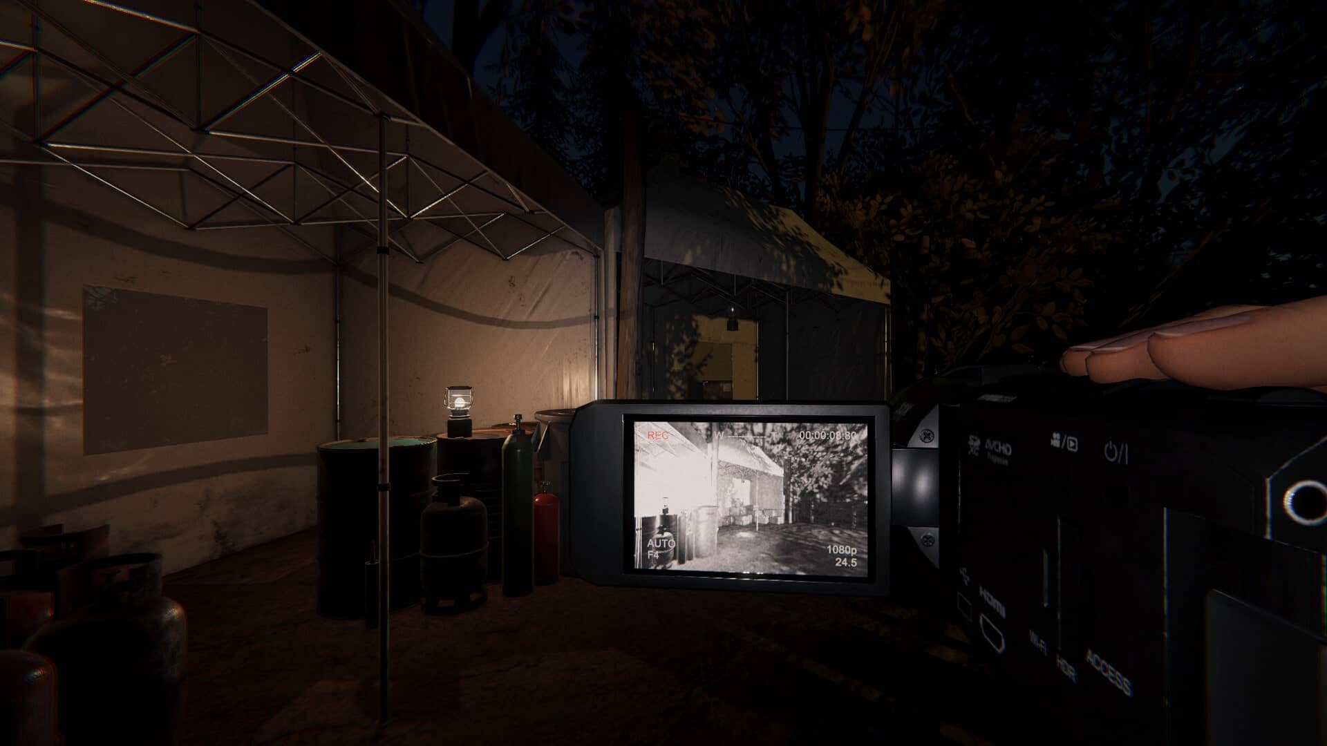 A player records a dark campsite using a night vision camera in Paranormal HK, revealing gas canisters and tents lit by a small lantern.