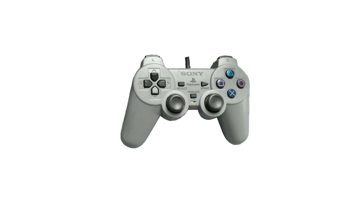 A gPlayStation Dual Analog Controller on a white background
