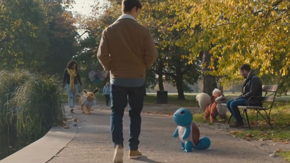 A man is walking with a dog in a regional park.
