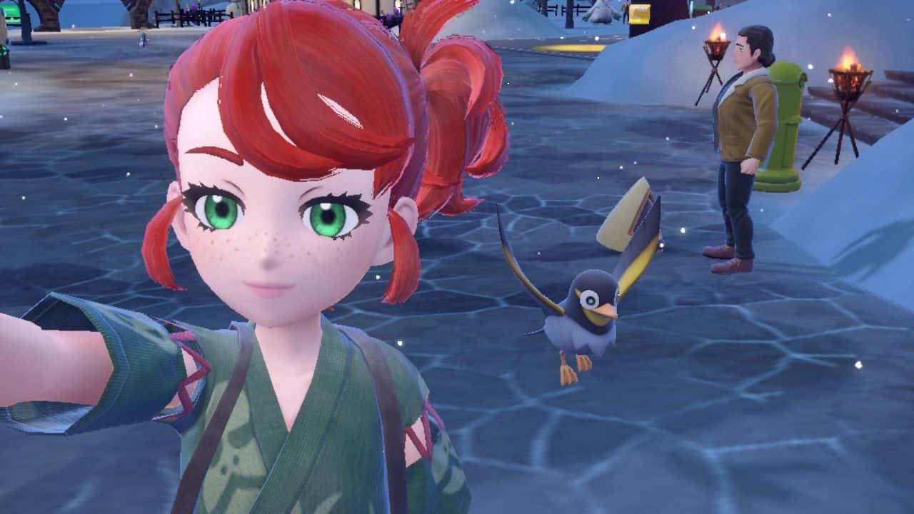 A girl with red hair is taking a picture of a Pokémon.