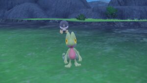 Pokemon-Scarlet-Violet-Indigo-Disk-Catch-Treecko-Pokemon-Standing-on-Grassy-Plateau