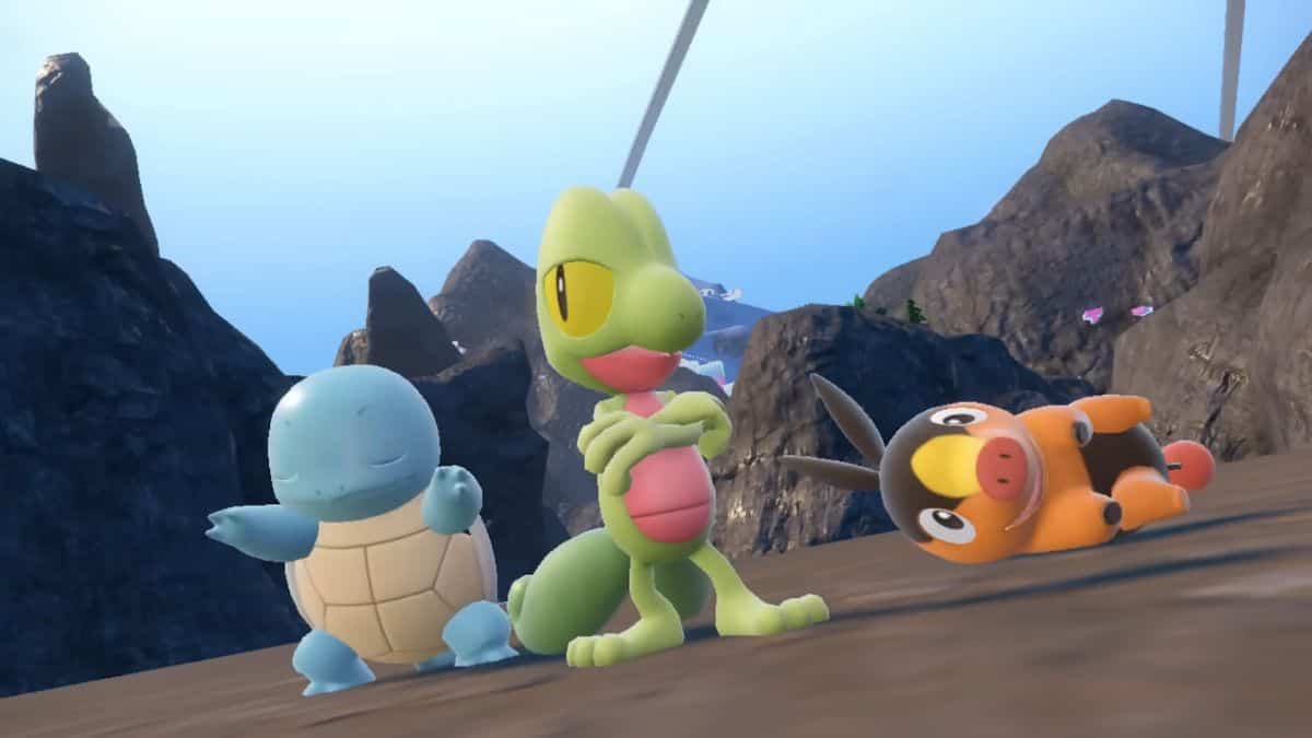 A group of all returning pokemon characters standing on a rock.
