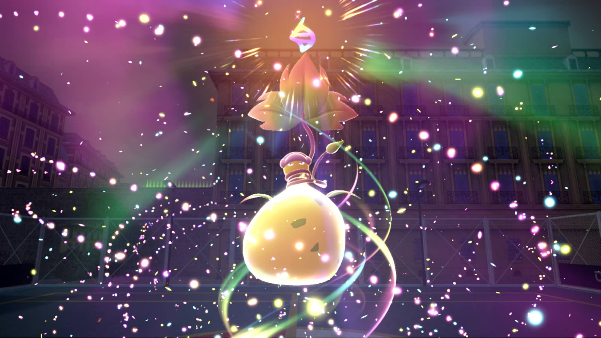 A glowing Pokémon undergoes Terastalization in Pokémon Scarlet and Violet, surrounded by colorful sparkles and a radiant light effect.