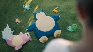A group of Pokemon toys peacefully scattered on the grass, inviting thoughts about Pokemon Sleep and how to make it work.