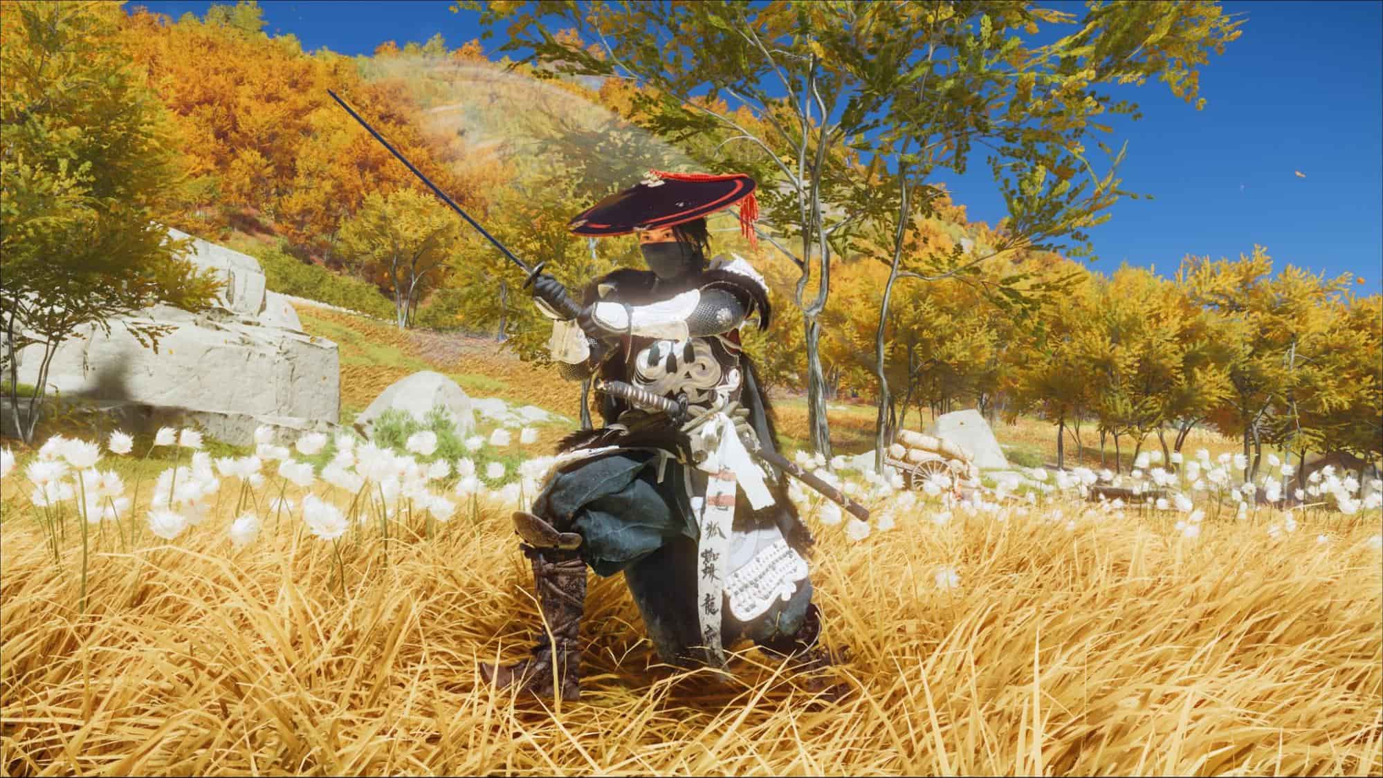 Atsu kneels with katana drawn in a defensive stance in Ghost of Yotei