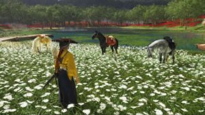 Character from Ghost of Yotei stands in a meadow of white flowers near three horses by a serene lake