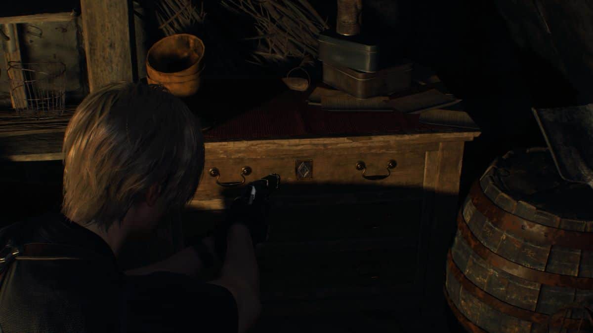 Resident Evil 4 Remake Leon finds a drawer to use the small key on