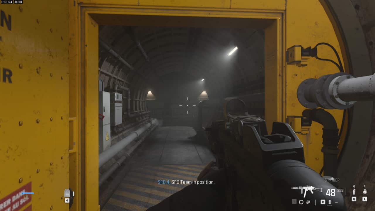 Modern Warfare 3 Trojan Horse: first-person view of a yellow door leading into a tunnel.
