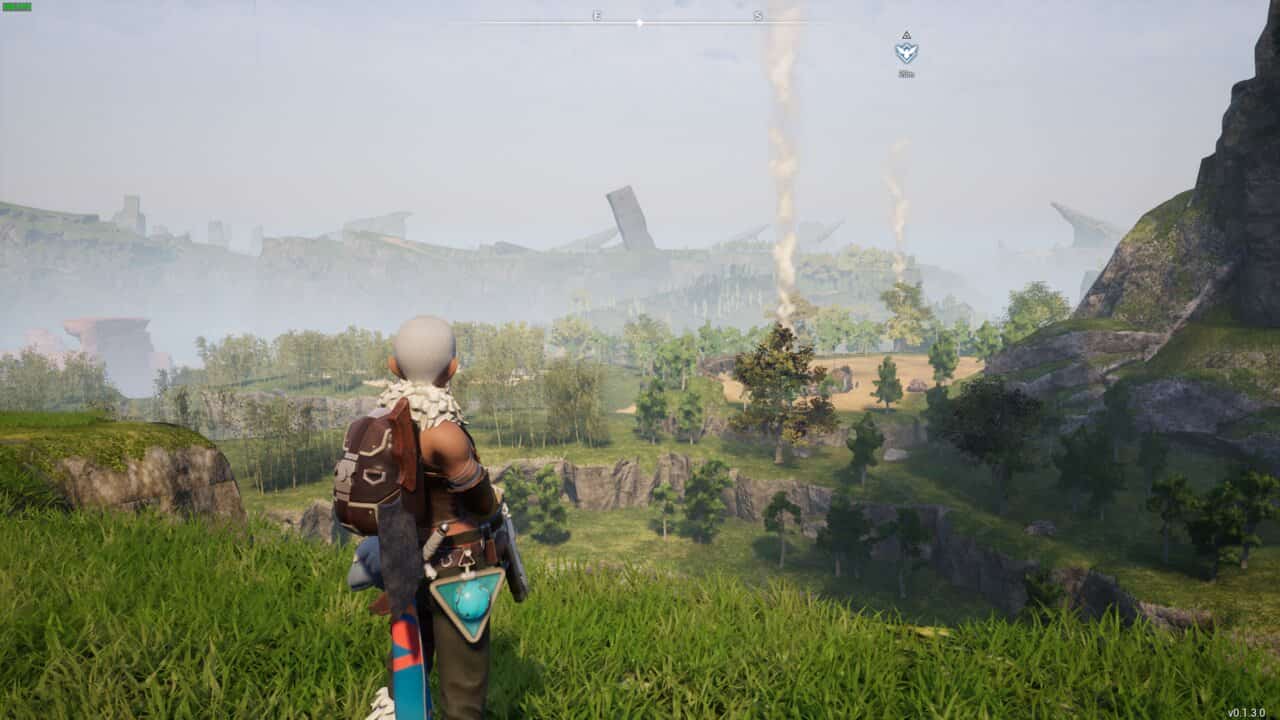 Palworld review: character overlooking a green valley with smoke stacks in the distance.