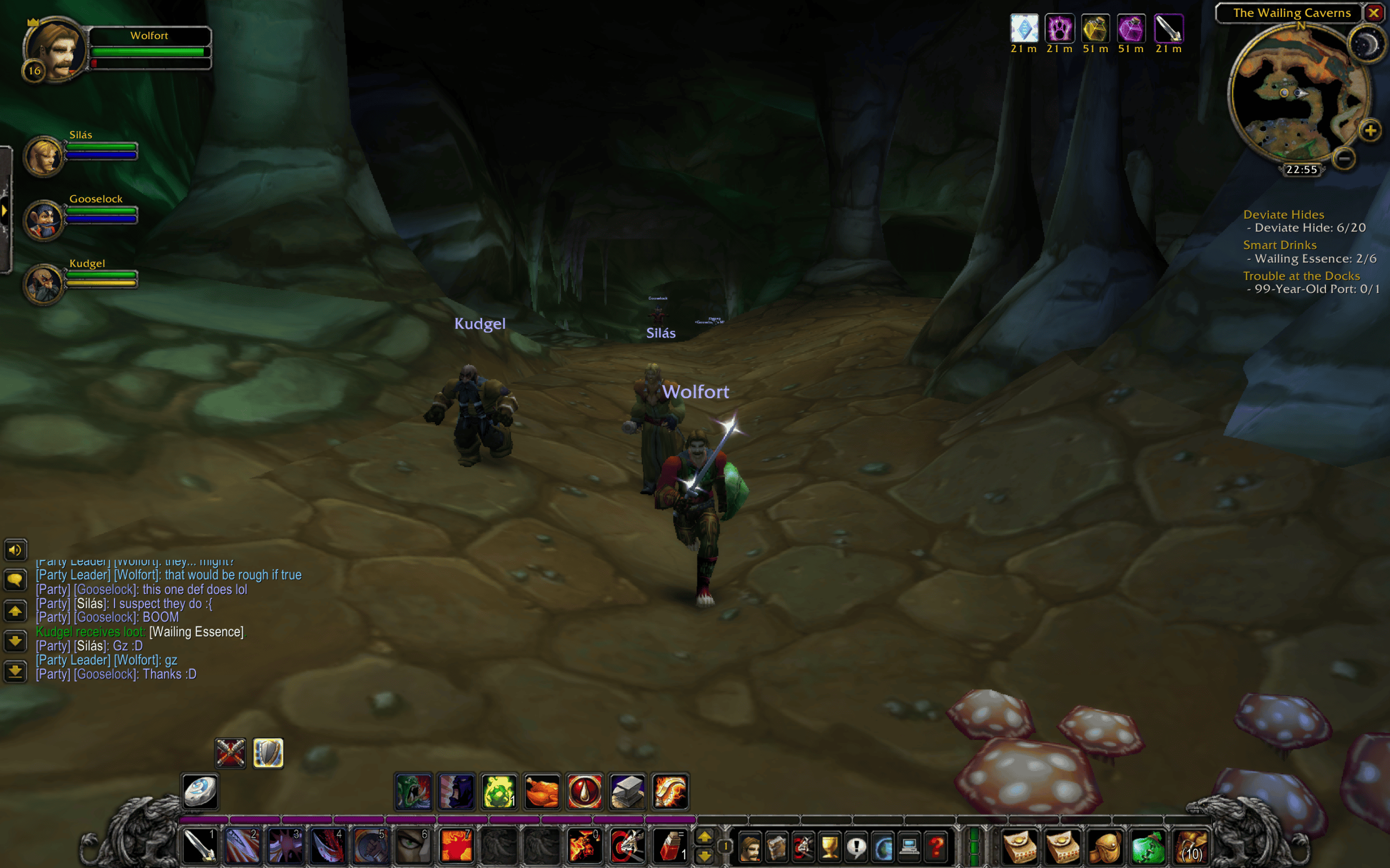 World of warcraft wailing caverns - three characters with weapons run through a cave.
