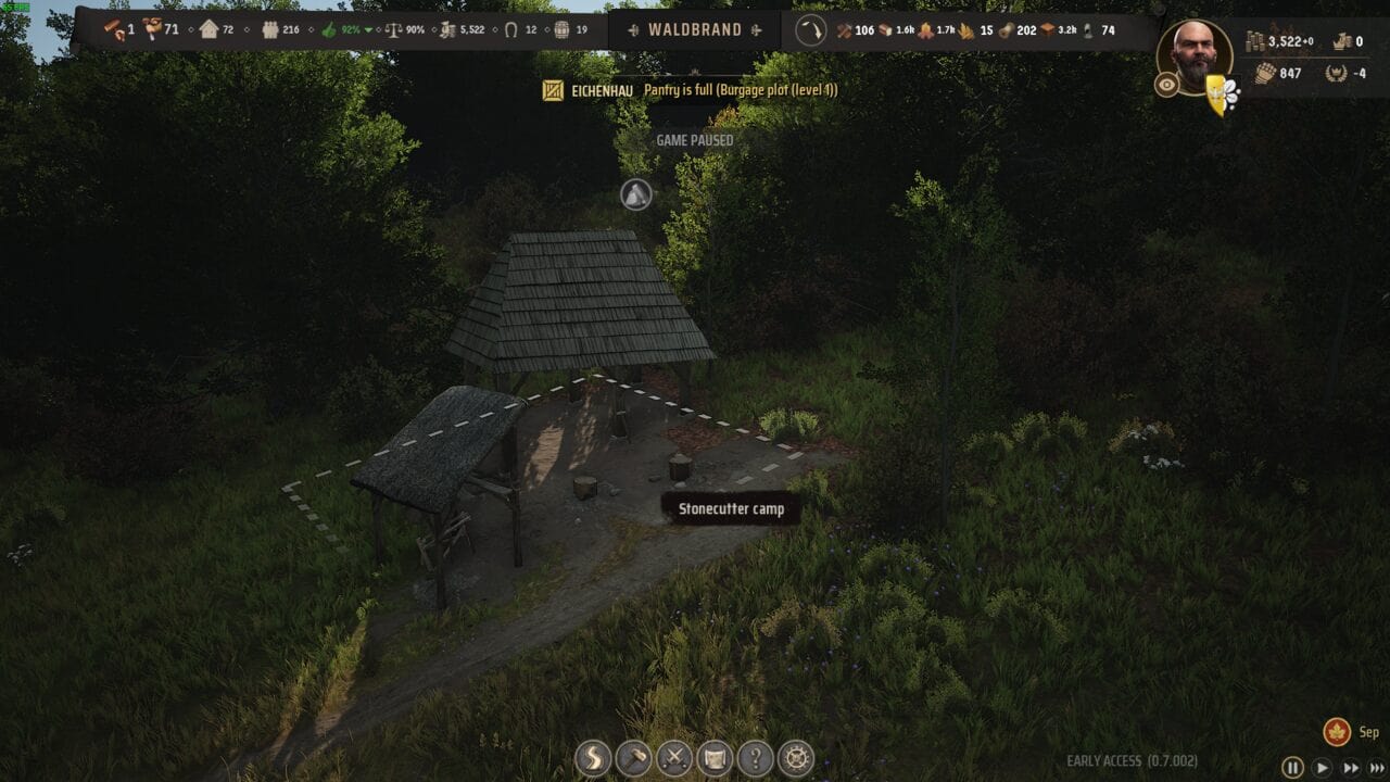 Manor Lords buildings: A screenshot from the video game Manor Lords displaying a stonecutter’s camp in a forested area, with user interface elements and game stats visible at the top and bottom.