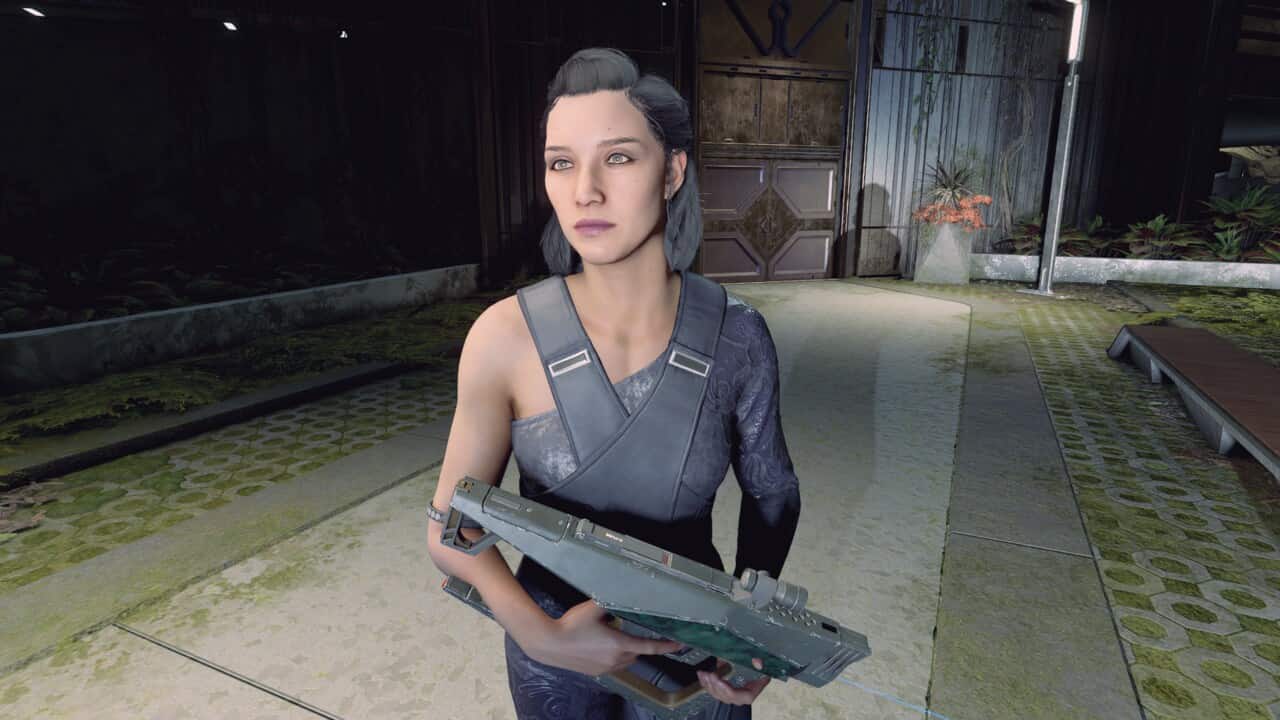 Starfield - do companions need ammo: Andreja walking with gun outside The Lodge in New Atlantis.
