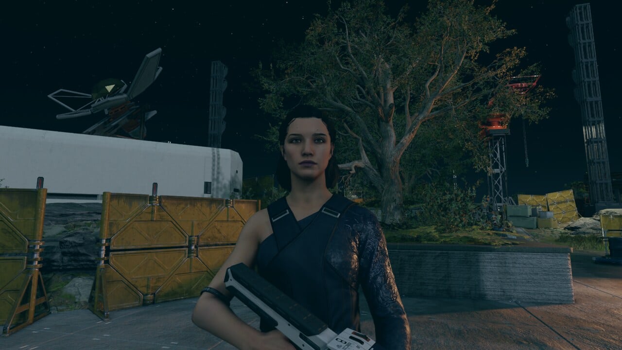 Starfield companions: Andreja with a gun at night.