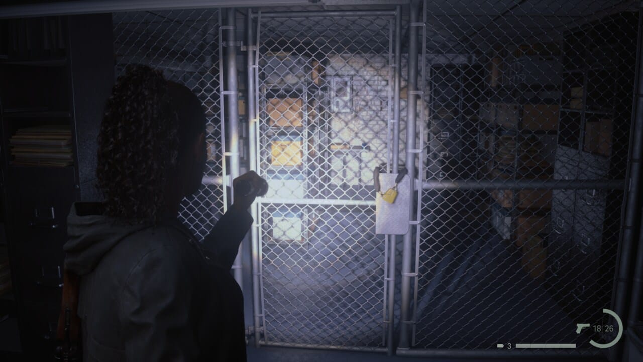 Alan Wake 2 Lighthouse key location: Saga shining flashlight on gate blocking access to the Cult Stash in the Sheriff's Station.