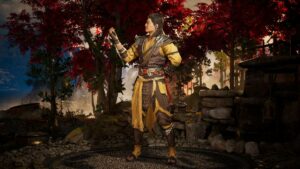A man in a costume is standing in front of a tree at Mortal Kombat 1.
