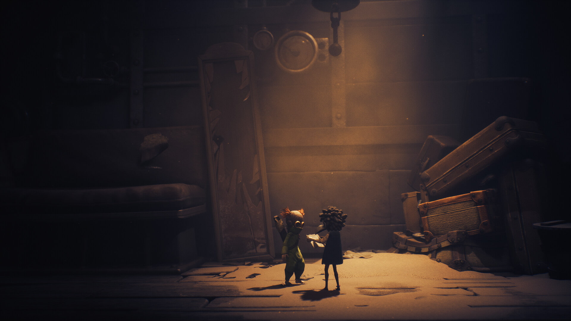 Low and Alone stand under a beam of light surrounded by old luggage in Little Nightmares 3