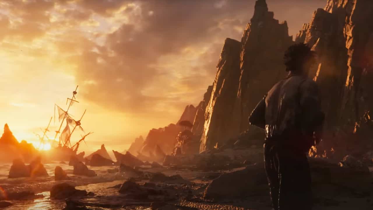 Skull and Bones release date: A castaway pirate looks out at the wreckage of his ship as the sun rises.