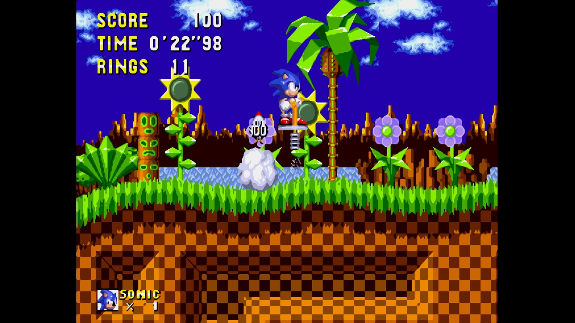 Sonic bounces on a spring in a vibrant Green Hill Zone remix during Sonic Hacking Contest 2025, surrounded by palm trees, flowers, and classic checkerboard terrain.