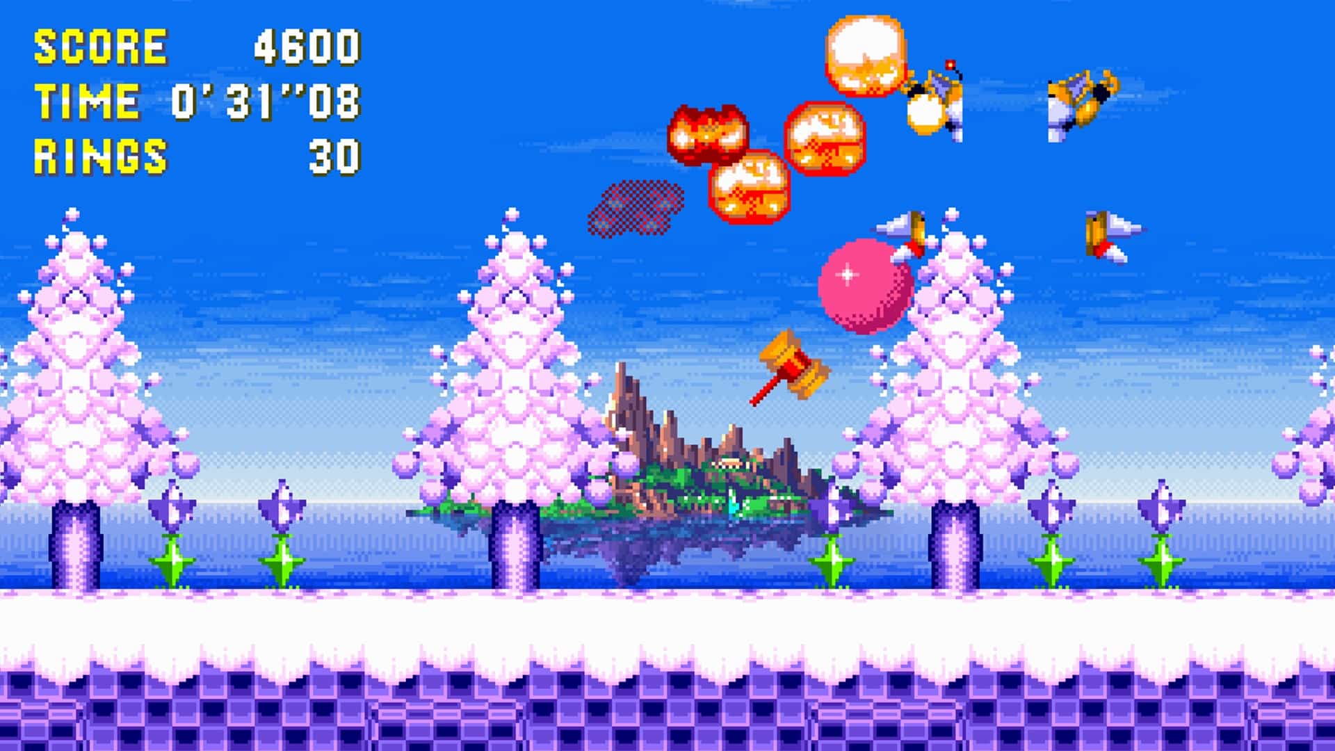 Sonic battles flying enemies in a snowy zone during Sonic Hacking Contest 2025, with pastel-colored trees, icy platforms, and a giant hammer power-up in midair.