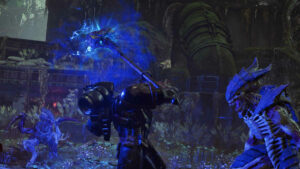 Picture of an assault space marine using a thunder hammer to execute a tyrannid warrior.