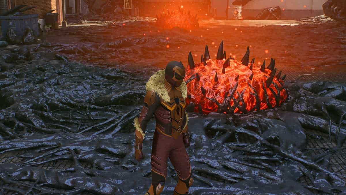 A man standing in front of a fire in a video game, surrounded by Symbiote nests.