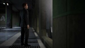 A man in a suit is standing in a hallway, contemplating how the Spider-Man 2 post-credits scenes / ending set up the next game.
