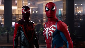 Spider-Man 2 release date: Peter Parker and Miles Morales stare towards the camera together, both fully suited up.