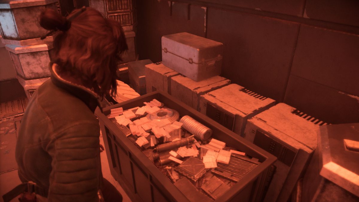 Star Wars Outlaws Counterfeit Credits - Kay standing over a case of Counterfeit Credits