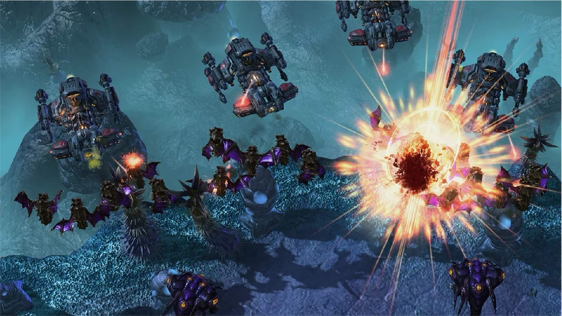 A dynamic sci-fi battle scene features flying alien creatures and mechanical aircraft exchanging fire in Starcraft II