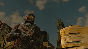 A man holding a gun in front of a building, where the starfield patch notes are finally here.