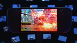 A Steam Deck with an OLED screen displaying a video game in front of a large screen.